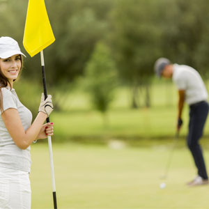 Young Couple Playing Golf